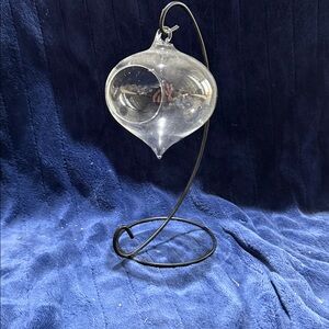 Clear Glass Hanging Teardrop Ornament on Black Metal Stand